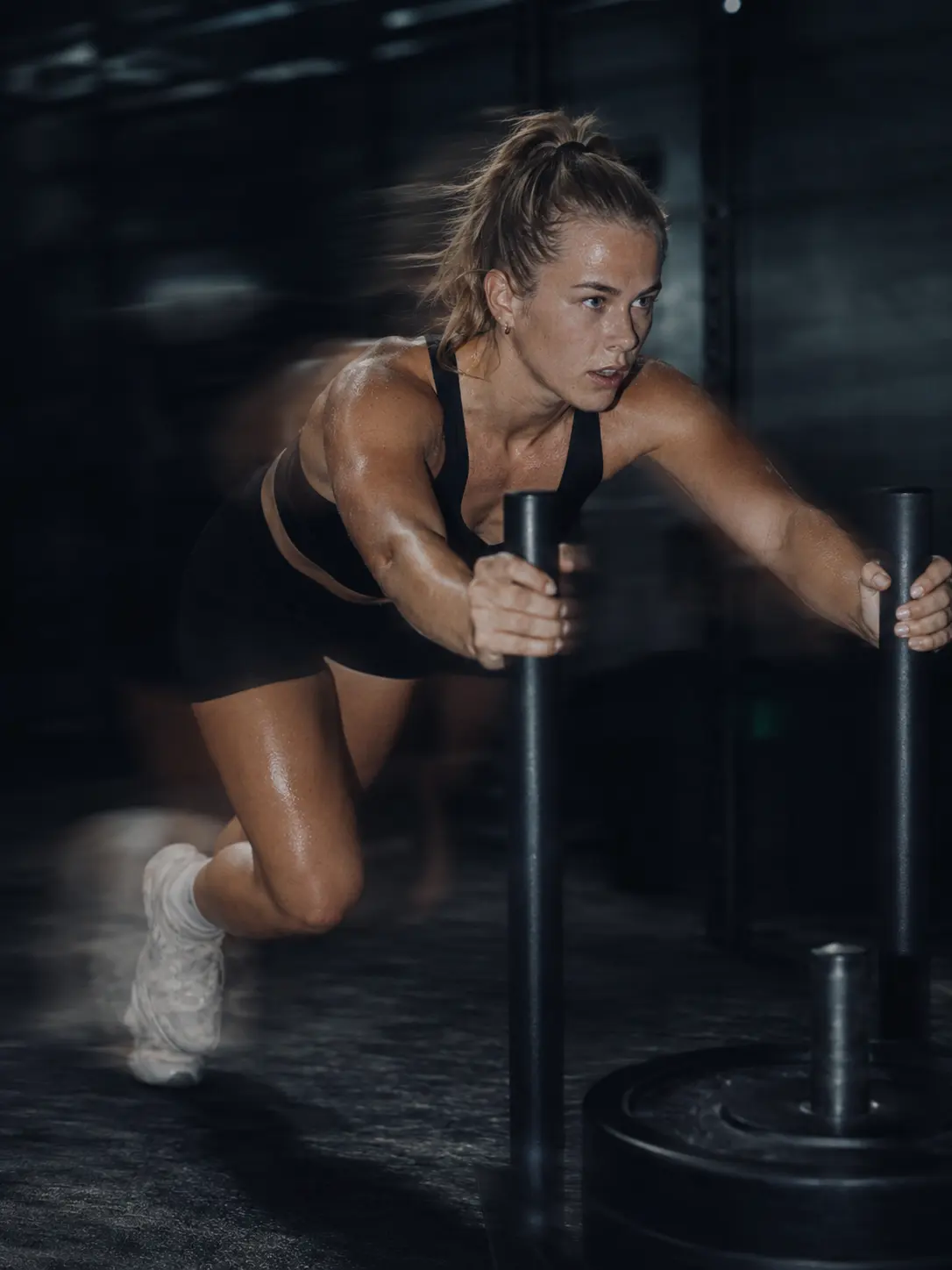A weighted sled being driven forward